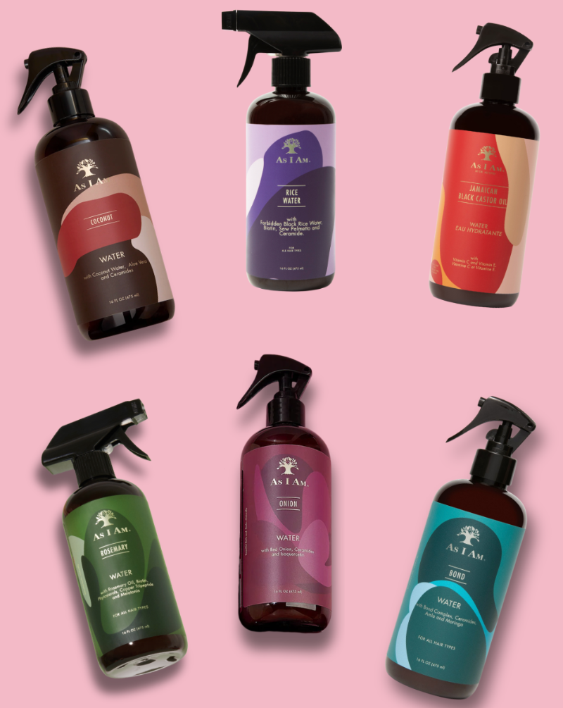 Set of As I Am hair care products on a pink background